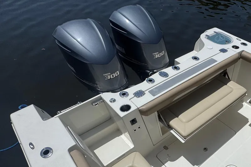 Slide: The Image of The image shows the stern of a 2017 Sailfish 325 DC with twin Yamaha 300 outboard engines. - 5