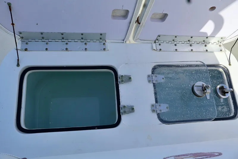 Slide: The Image of 2018 Sea Hunt Gamefish 27 Coffin Box with open compartments and hinges. - 11