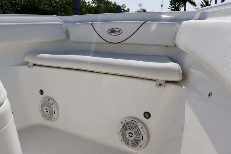 Slide: The Image of 2018 Sea Hunt Gamefish 27 Coffin Box interior with speakers and cushioned seating. - 21