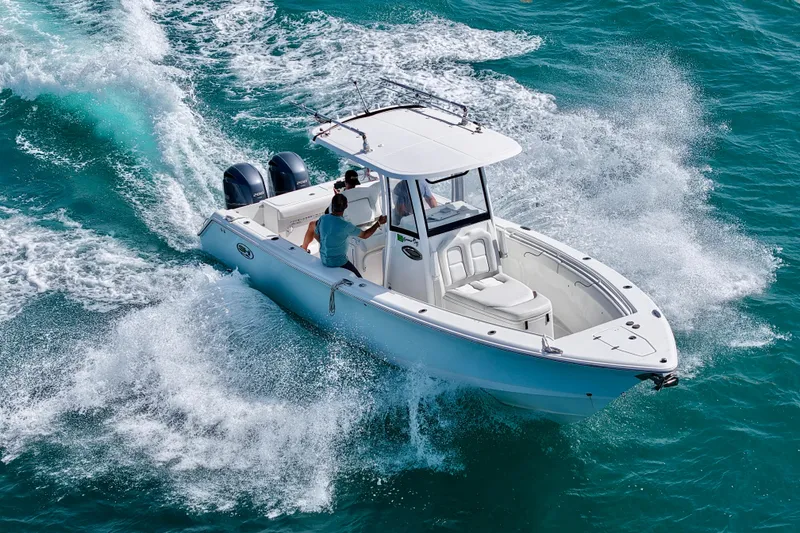 Slide: The Image of 2018 Sea Hunt Gamefish 27 Coffin Box cruising on turquoise waters. - 5