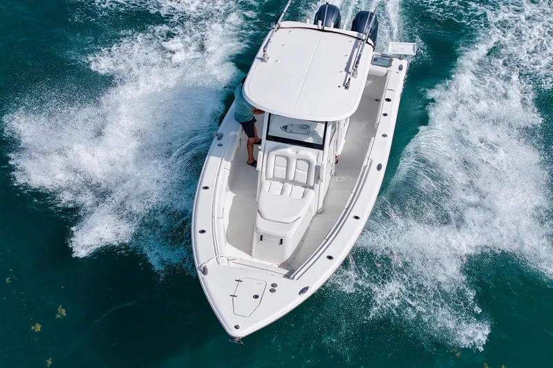 Slide: The Image of 2018 Sea Hunt Gamefish 27 Coffin Box cruising on clear blue water. - 6