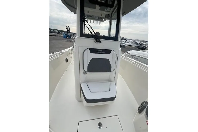 Slide: The Image of 2026 Cobia 245 Center Console boat interior with seating and console view. - 15