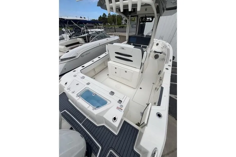 Slide: The Image of 2026 Cobia 245 Center Console boat with spacious deck and seating area. - 5