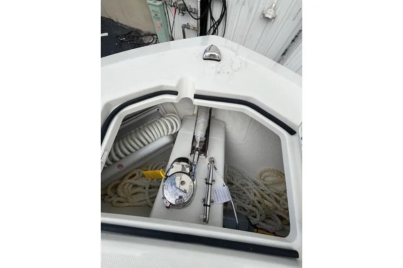 Slide: The Image of Anchor storage area of 2026 Cobia 245 Center Console boat. - 14