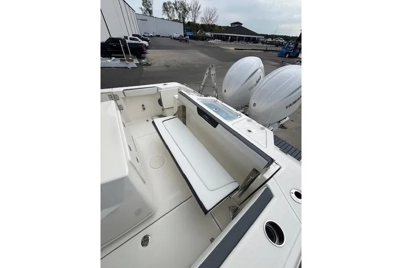 Slide: The Image of 2026 Cobia 245 Center Console boat with dual Yamaha engines, featuring spacious seating. - 6