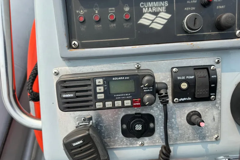 Slide: The Image of Control panel of a 1996 Willard Marine Sea Force 730 with radio and bilge pump switches. - 21