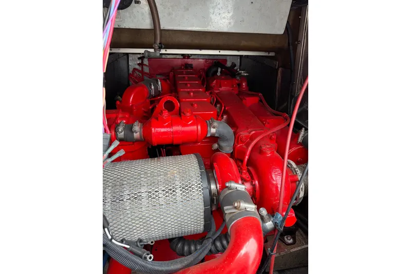Slide: The Image of Red engine inside a 1996 Willard Marine Sea Force 730 boat. - 16
