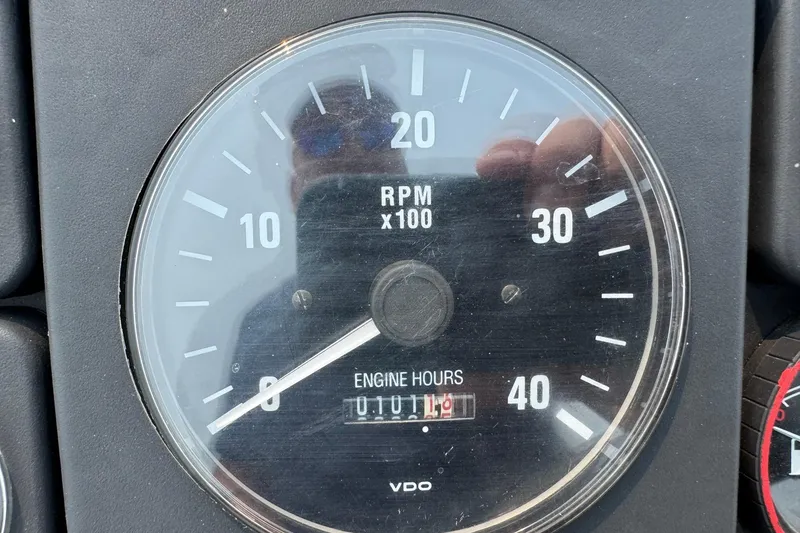 Slide: The Image of Tachometer of 1996 Willard Marine Sea Force 730 showing RPM and engine hours. - 24