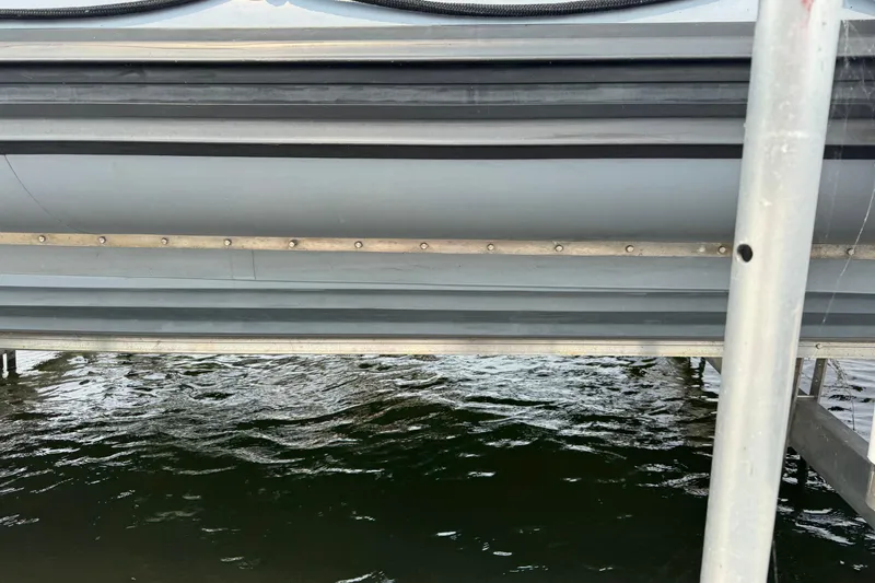 Slide: The Image of Close-up of 1996 Willard Marine Sea Force 730 hull above water. - 6