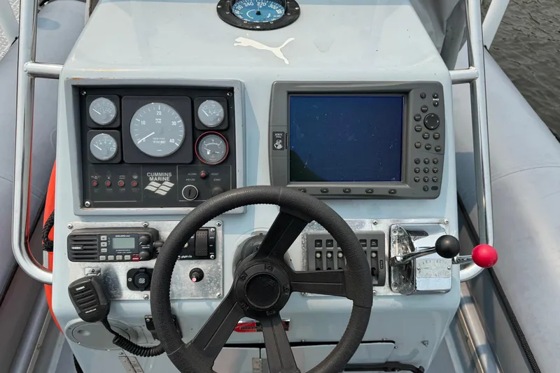 Slide: The Image of Control panel of a 1996 Willard Marine Sea Force 730 boat with navigation equipment. - 19