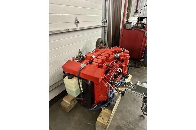 Slide: The Image of Red marine engine for 1996 Willard Marine Sea Force 730, displayed in a workshop setting. - 34