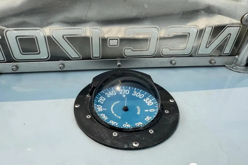 Slide: The Image of Compass on Willard Marine Sea Force 730, 1996 model, with reflective surface and bolts. - 23