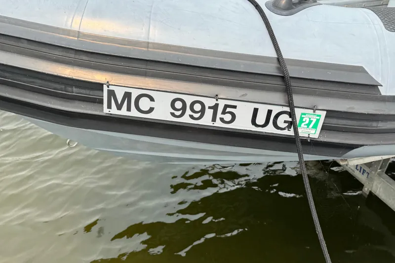 Slide: The Image of 1996 Willard Marine Sea Force 730 boat with registration MC 9915 UG on water. - 4