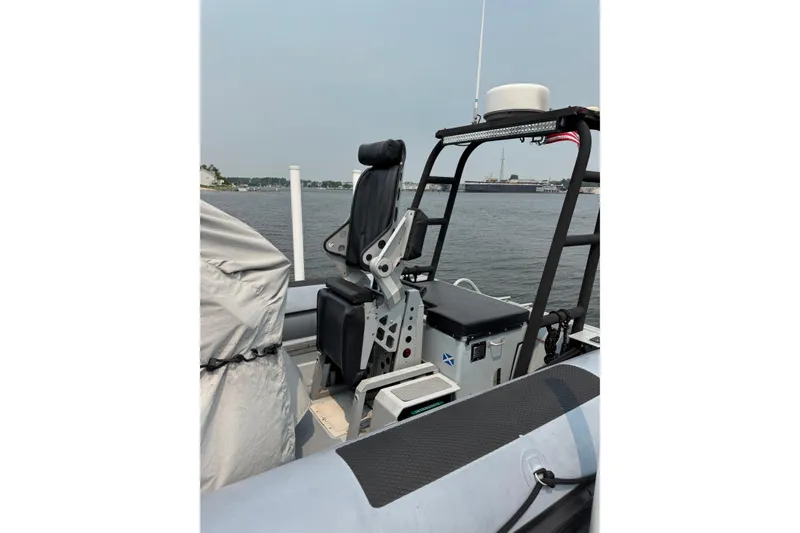 Slide: The Image of 1996 Willard Marine Sea Force 730 boat interior with seating and control panel. - 10