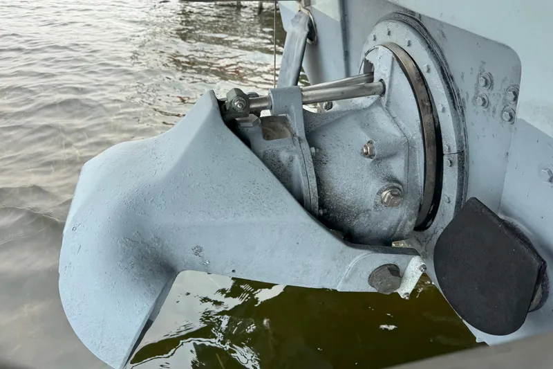 Slide: The Image of Close-up of a 1996 Willard Marine Sea Force 730 boat component near water. - 32