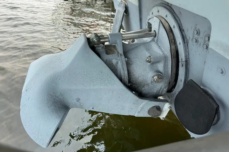 Slide: The Image of Close-up of a 1996 Willard Marine Sea Force 730 boat's propulsion system in water. - 31