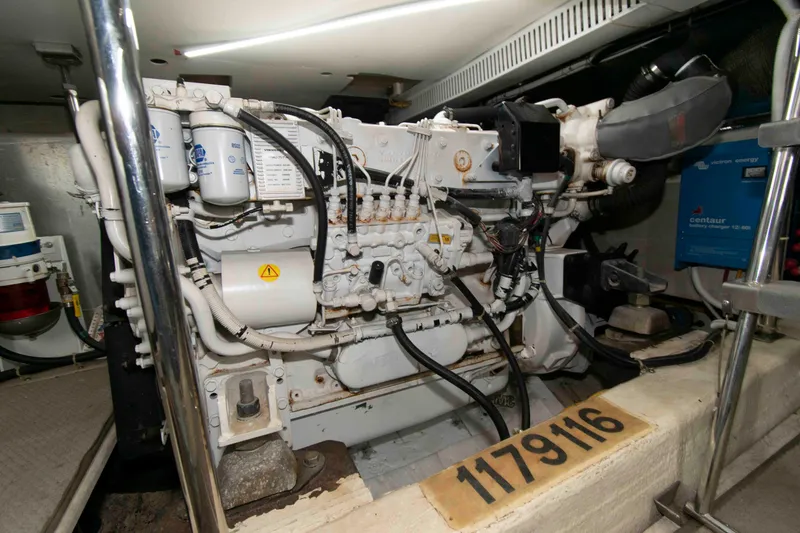 Slide: The Image of Engine room of 2005 Carver 466 Motor Yacht, showcasing detailed machinery components. - 28