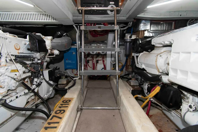 Slide: The Image of Engine room of a 2005 Carver 466 Motor Yacht, showcasing machinery and equipment. - 26