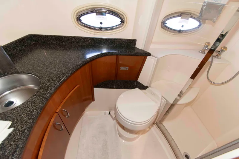 Slide: The Image of Luxurious bathroom in 2005 Carver 466 Motor Yacht with granite countertop and shower. - 24