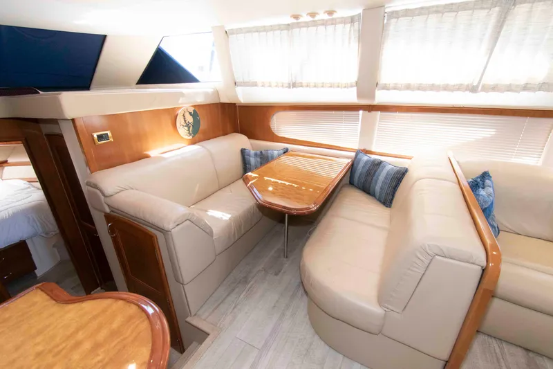 Slide: The Image of Luxurious interior of 2005 Carver 466 Motor Yacht with plush seating and elegant decor. - 19