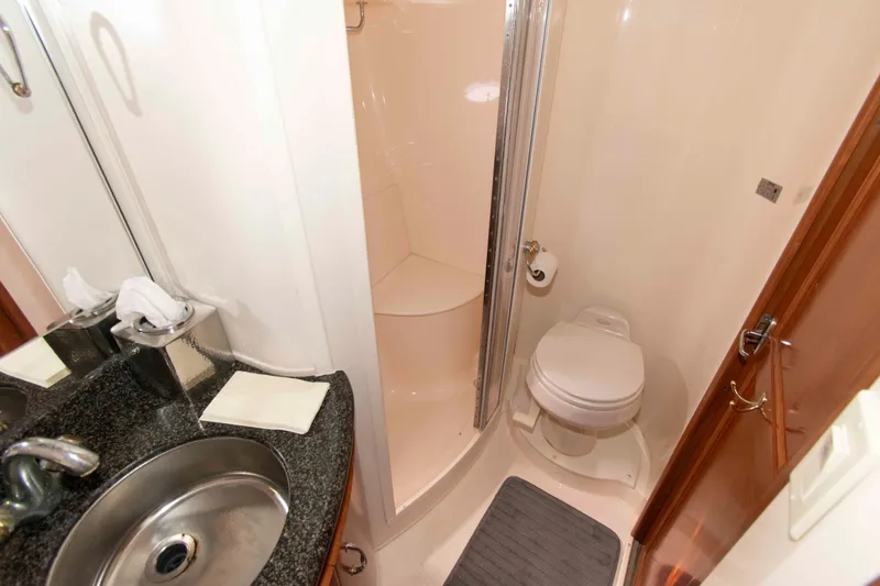 Slide: The Image of Bathroom interior of 2005 Carver 466 Motor Yacht with shower, sink, and toilet. - 21