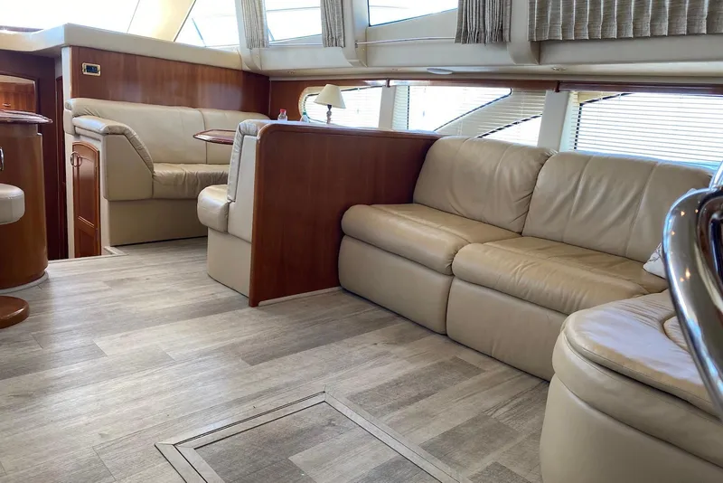 Slide: The Image of Luxurious interior of a 2005 Carver 466 Motor Yacht with beige leather seating. - 7