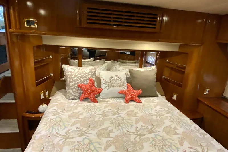 Slide: The Image of Luxurious bedroom interior of 2005 Carver 466 Motor Yacht with starfish-themed decor. - 9