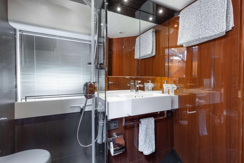 Slide: The Image of Luxurious bathroom interior of 2012 Princess 60 yacht with modern fixtures and wooden accents. - 33