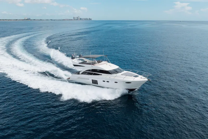 Slide: The Image of Luxury 2012 Princess 60 yacht cruising on open sea, leaving a wake behind. - 13