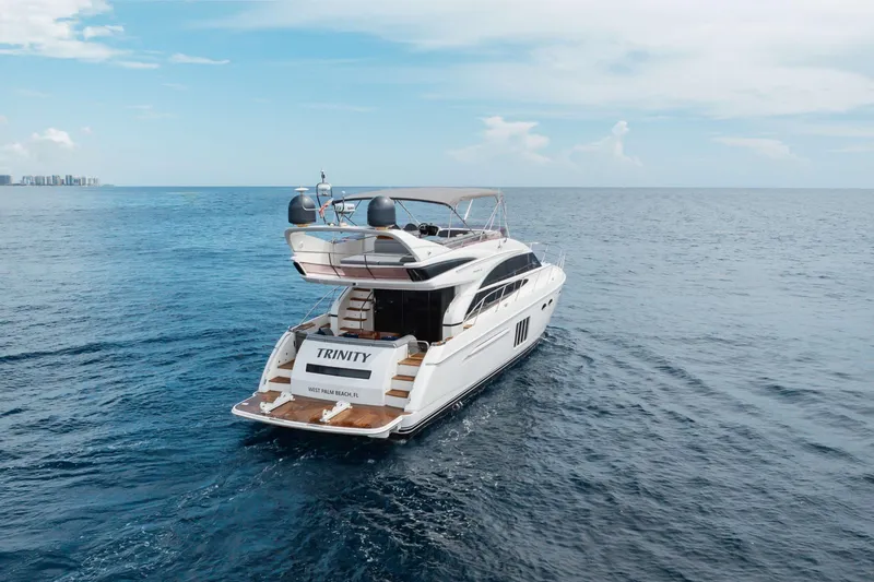 Slide: The Image of Luxury 2012 Princess 60 yacht cruising on open sea under clear skies. - 11