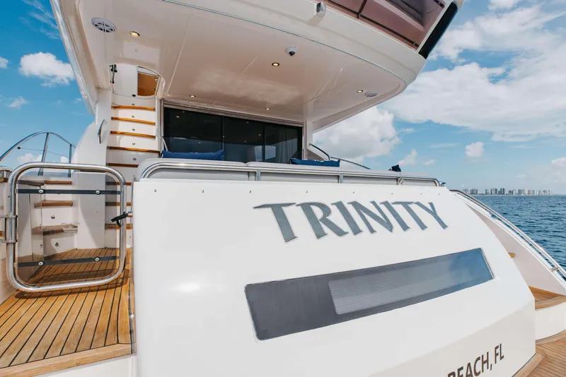 Slide: The Image of Luxury yacht "Trinity" docked, showcasing elegant design and ocean view, 2012 Princess 60 model. - 53