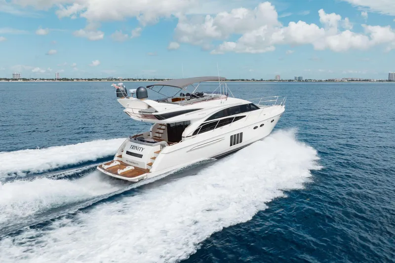 Slide: The Image of Luxurious 2012 Princess 60 yacht cruising on open water under a clear blue sky. - 3