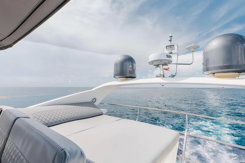 Slide: The Image of Luxurious 2012 Princess 60 yacht cruising on open sea under clear blue sky. - 44