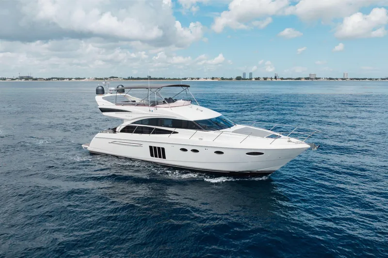 Slide: The Image of Luxurious 2012 Princess 60 yacht cruising on open sea under a clear blue sky. - 10