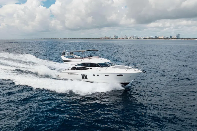 Slide: The Image of Luxury 2012 Princess 60 yacht cruising on open sea under cloudy sky. - 5