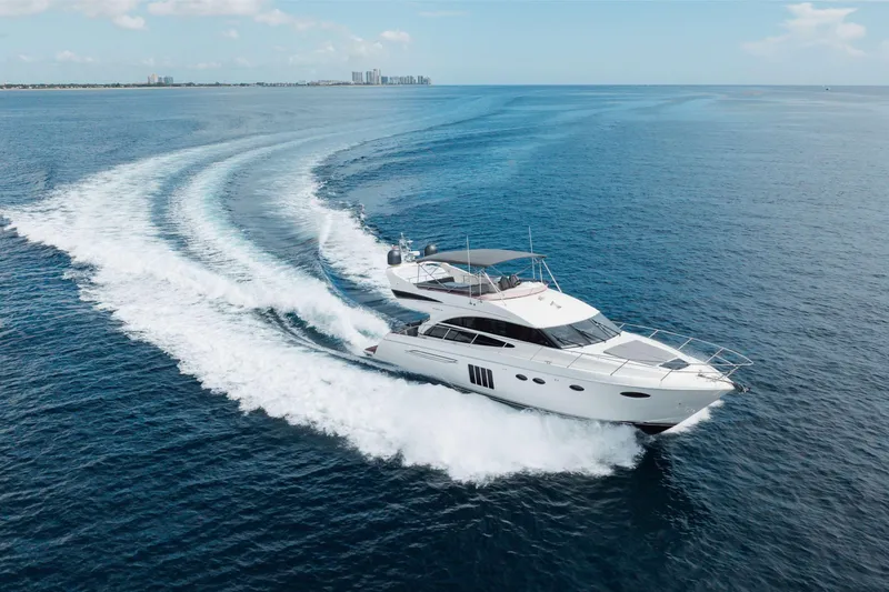 Slide: The Image of Luxurious 2012 Princess 60 yacht cruising on open sea, leaving a dynamic wake. - 4