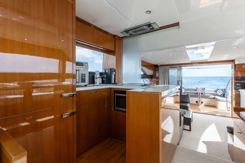 Slide: The Image of Luxurious interior of 2012 Princess 60 yacht with ocean view and modern kitchen amenities. - 23