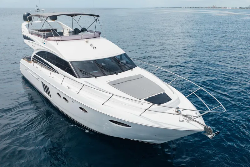 Slide: The Image of Luxurious 2012 Princess 60 yacht cruising on open sea, showcasing sleek design and elegance. - 6