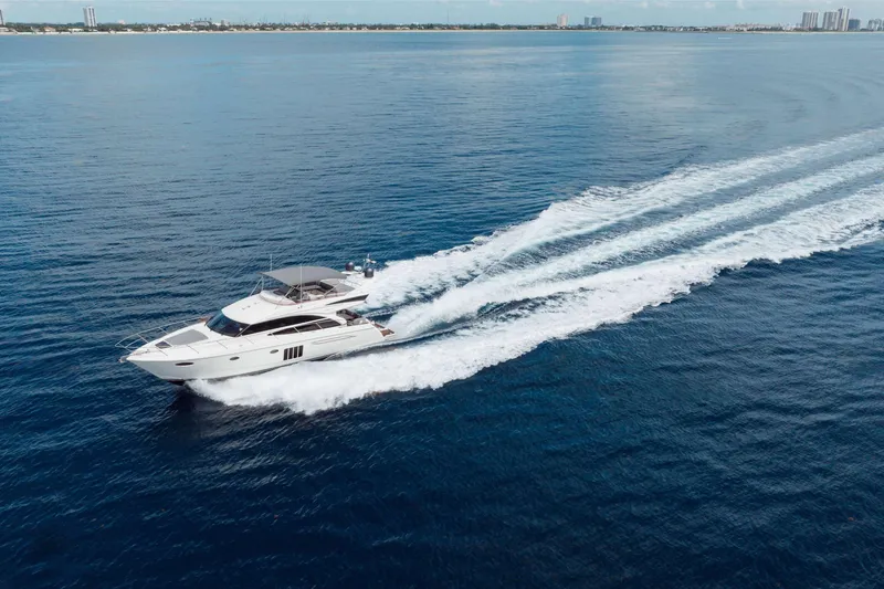 Slide: The Image of Aerial view of 2012 Princess 60 yacht cruising on open blue sea. - 12