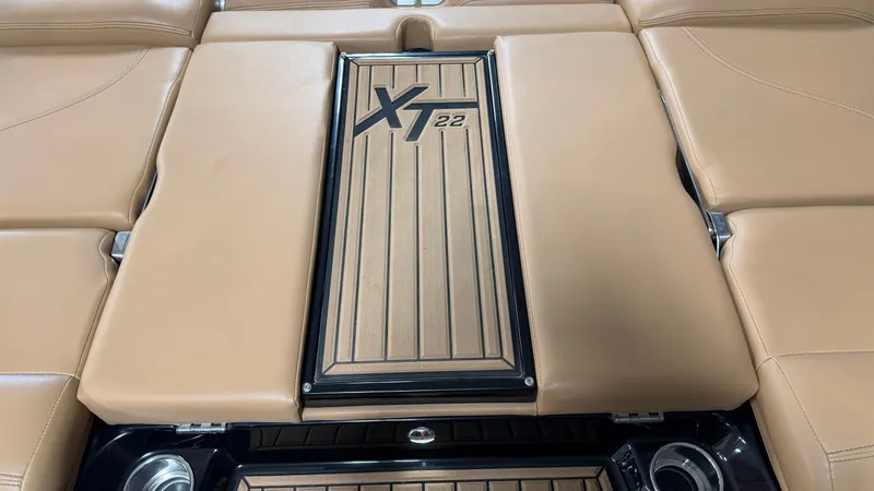 Slide: The Image of The image shows the brown upholstery and logo of the 2019 MasterCraft XT22. - 17