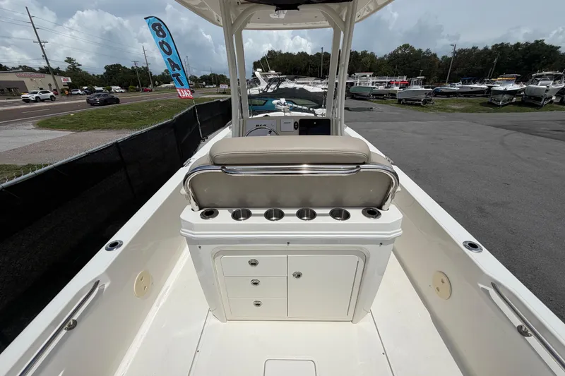 Slide: The Image of 2022 Boston Whaler 250 Dauntless boat interior with seating and storage compartments. - 13