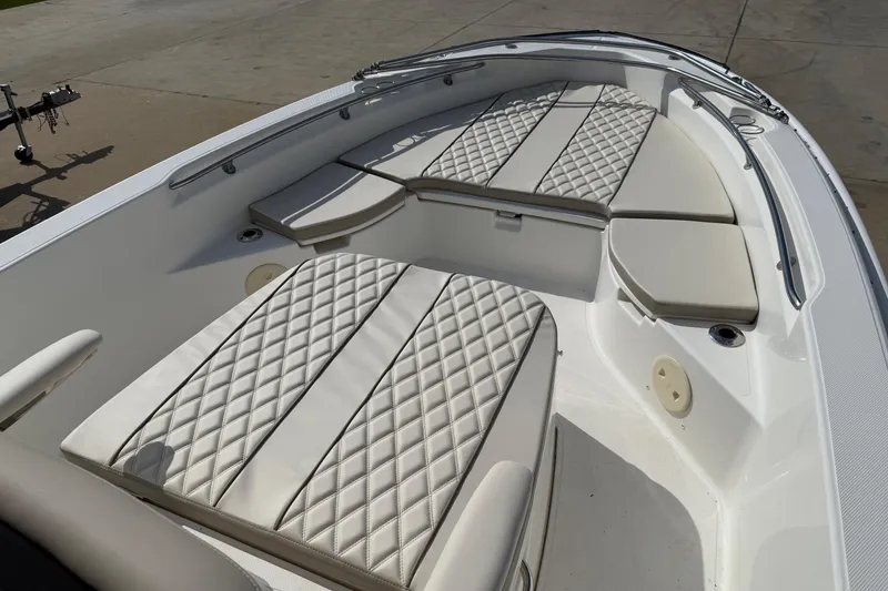 Slide: The Image of 2022 Boston Whaler 250 Dauntless boat interior with diamond-stitched seating and spacious layout. - 10