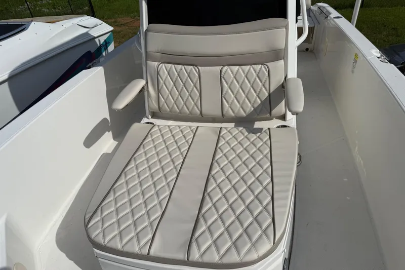 Slide: The Image of 2022 Boston Whaler 250 Dauntless boat seat with diamond-stitched upholstery and armrests. - 12