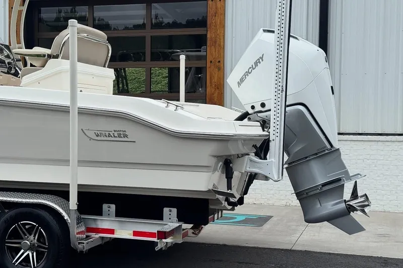 Slide: The Image of 2022 Boston Whaler 250 Dauntless boat with Mercury engine on trailer. - 3