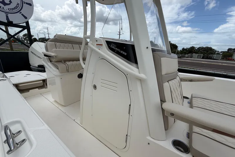 Slide: The Image of 2022 Boston Whaler 250 Dauntless boat interior with seating and console details. - 45