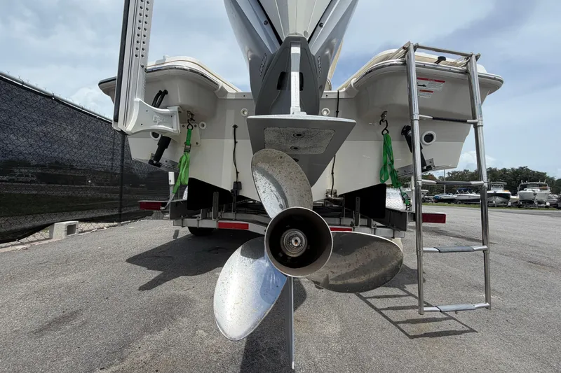 Slide: The Image of 2022 Boston Whaler 250 Dauntless boat stern view with propeller and ladder. - 4