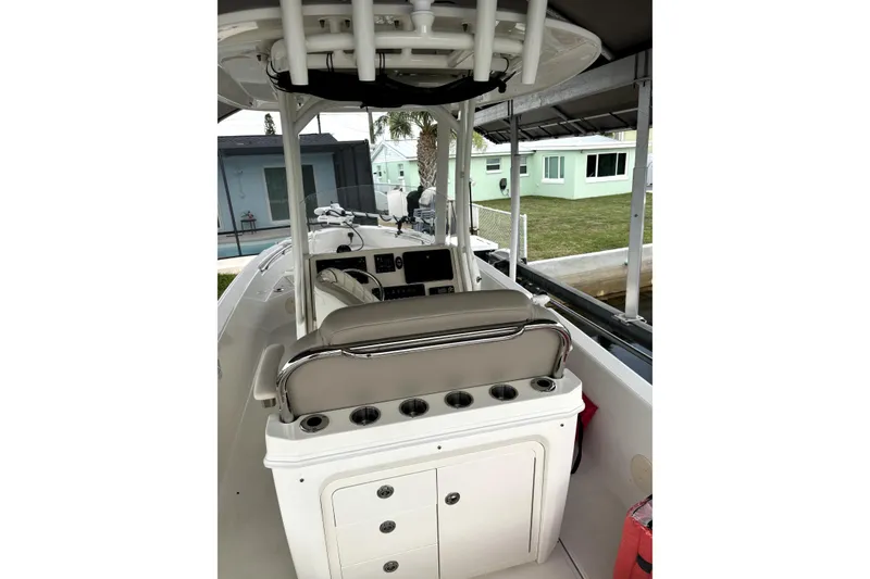 Slide: The Image of 2022 Boston Whaler 250 Dauntless boat interior with seating and storage compartments. - 22