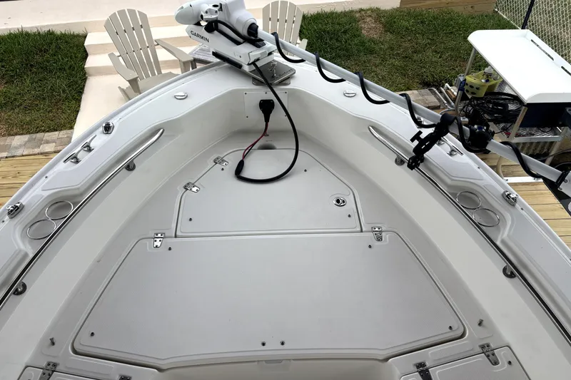Slide: The Image of 2022 Boston Whaler 250 Dauntless boat deck with Garmin equipment and seating area. - 21