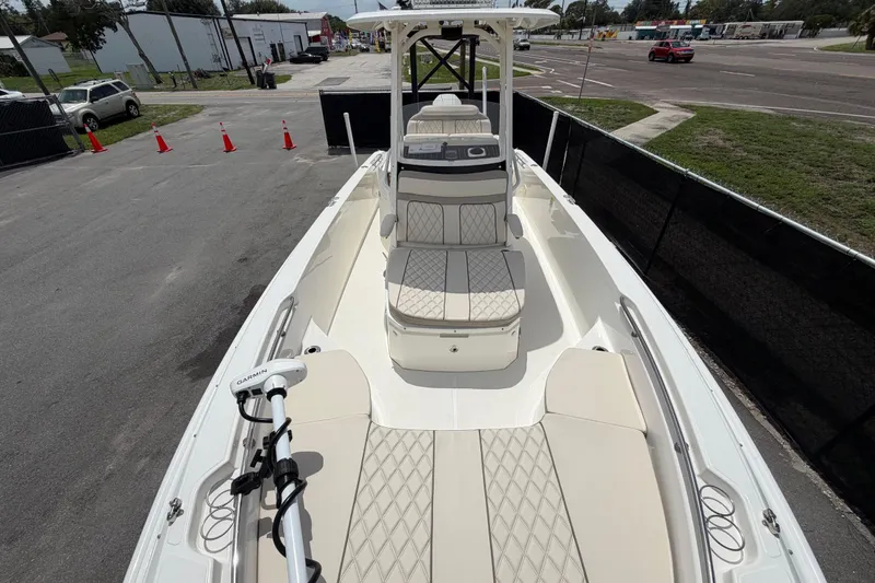Slide: The Image of 2022 Boston Whaler 250 Dauntless boat with cushioned seating and Garmin equipment. - 37
