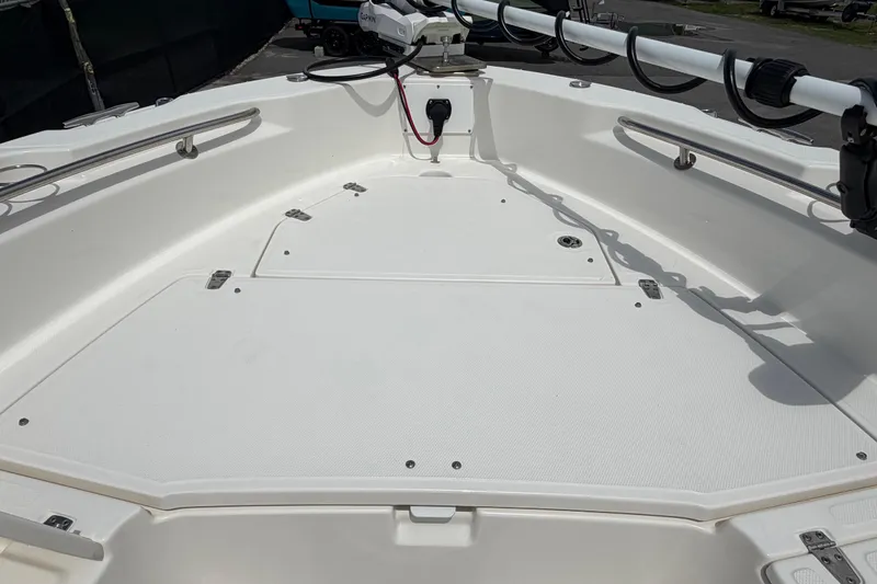 Slide: The Image of 2022 Boston Whaler 250 Dauntless boat deck with storage compartments and railing. - 30